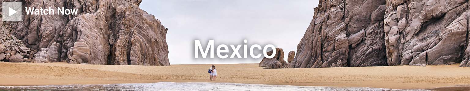 Image of couple on beach of Mexican Riviera. Click here to watch video of The festive spirit of awaits on a Mexico Cruise | Princess Cruises