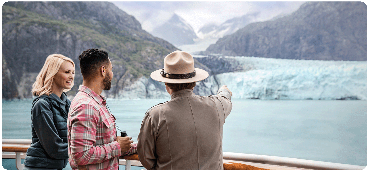 Guests learning from a ranger in Glacier Bay National Park. Click here to learn more.