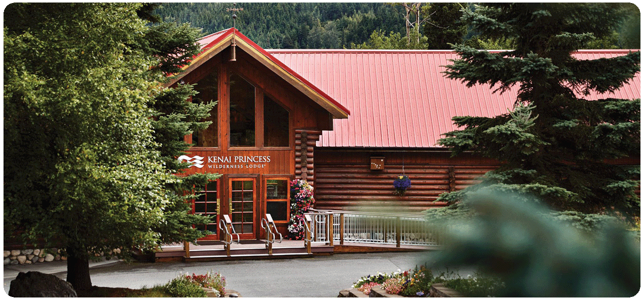 Kenai Princess Wilderness Lodge with lush greenery surrounding it. Click here to learn more.